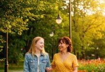 The Ultimate Guide to Parenting Through the Teenage Years Parent and teen walking in park,
