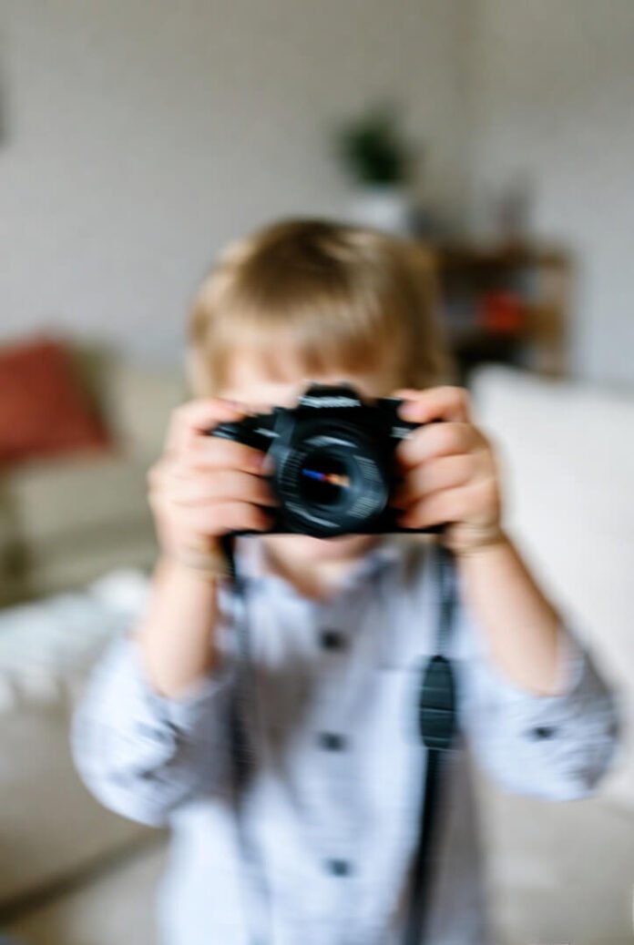 Toddler’s sneaky low-angle phone selfie grab. Toddler’s sneaky low-angle phone selfie grab.