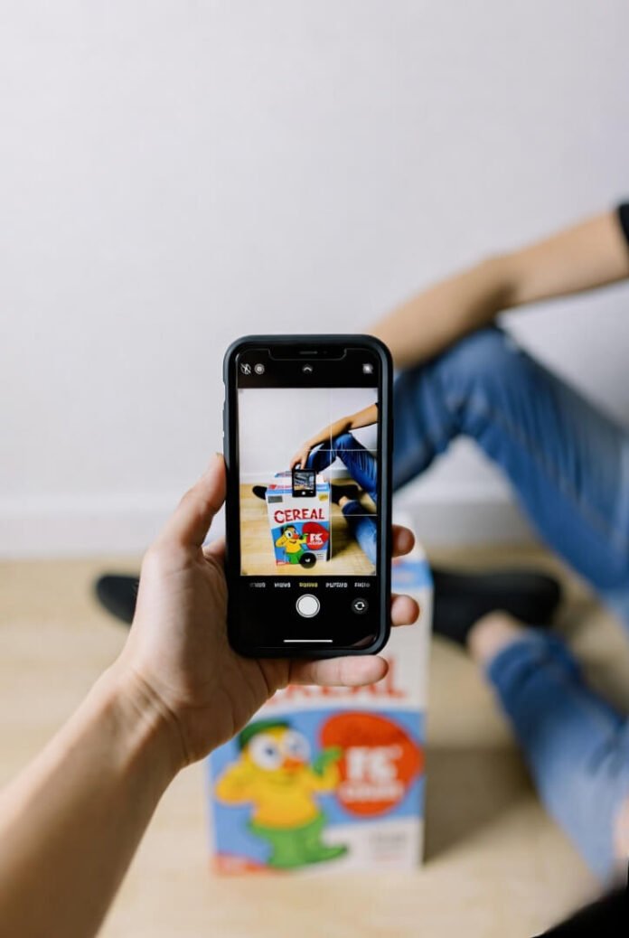Low-angle self-portrait with cereal box prop Low-angle self-portrait with cereal box prop