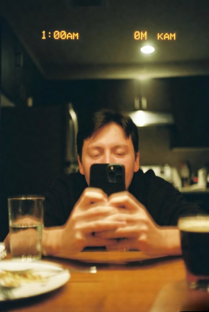 Crooked, bleary-eyed kitchen selfie at 1:00 a.m. — hand shaking from too much coffee, dark circles, empty mug nearby. Crooked, bleary-eyed kitchen selfie at 1:00 a.m. — hand shaking from too much coffee, dark circles, empty mug nearby.