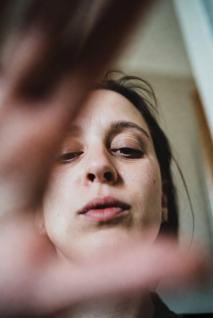 First-person view of a weary parent — hand trembling, frame tilted, eyes barely open from fatigue. First-person view of a weary parent — hand trembling, frame tilted, eyes barely open from fatigue.