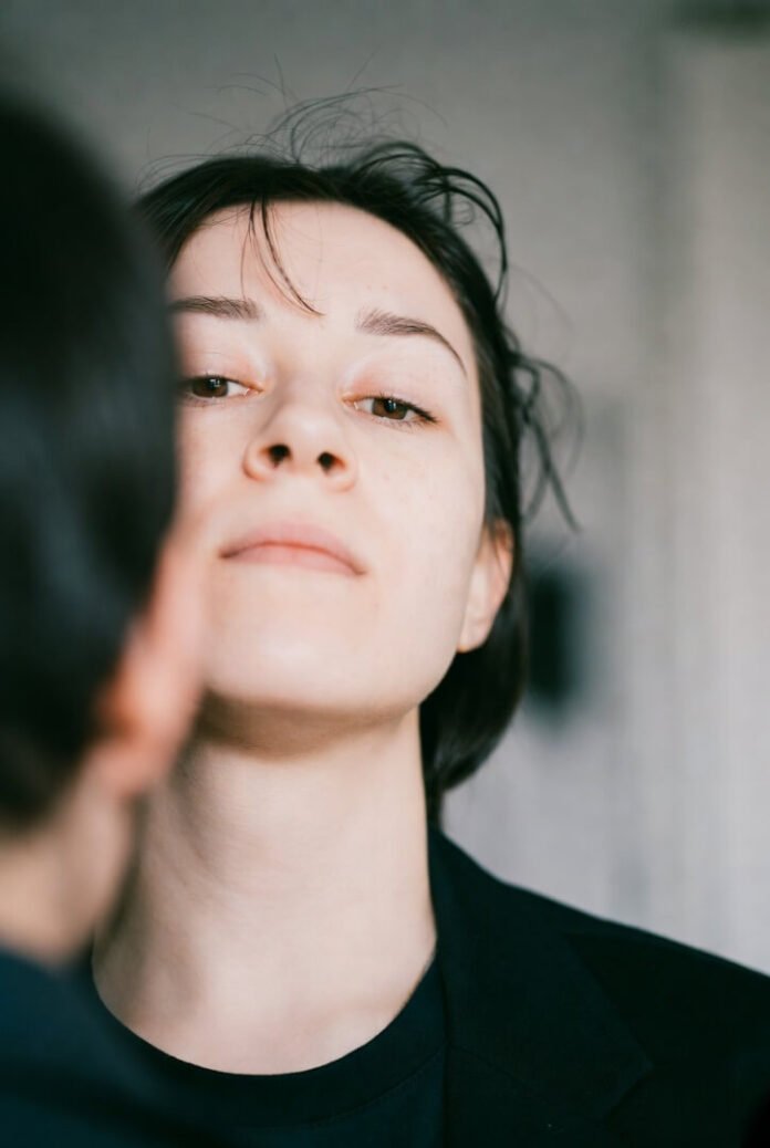"Low messy angle of someone comforting a friend, phone dropped, half face cut off" "Low messy angle of someone comforting a friend, phone dropped, half face cut off"
