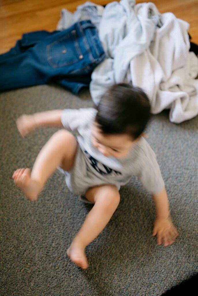 Blurry first steps toward living room laundry pile