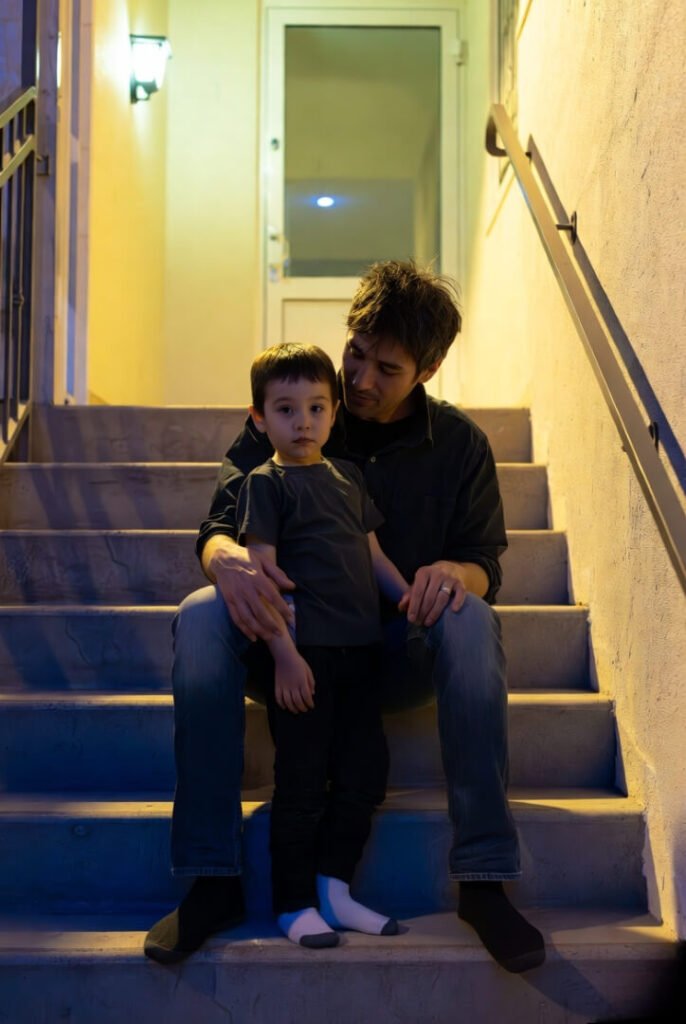 Sock-missing kid, serious hallway stair moment