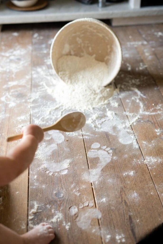 Toddler’s triumphant spoon and flour trail